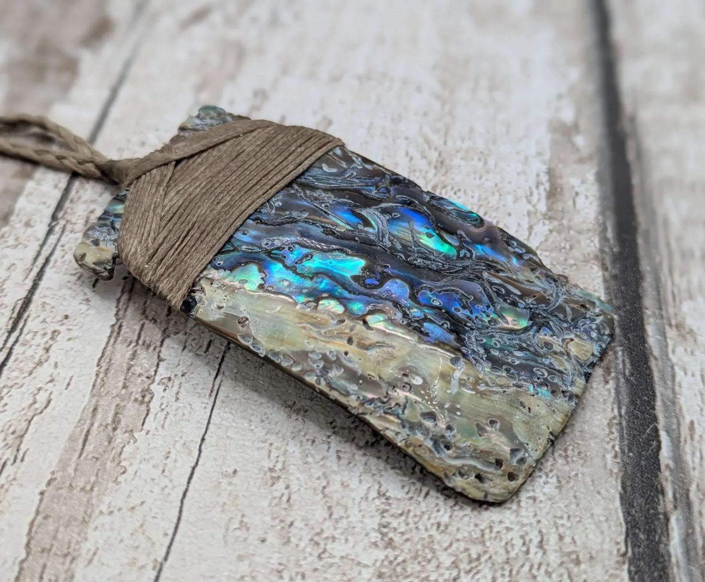 Wild New Zealand rainbow Pāua Hei Toki adze pendant