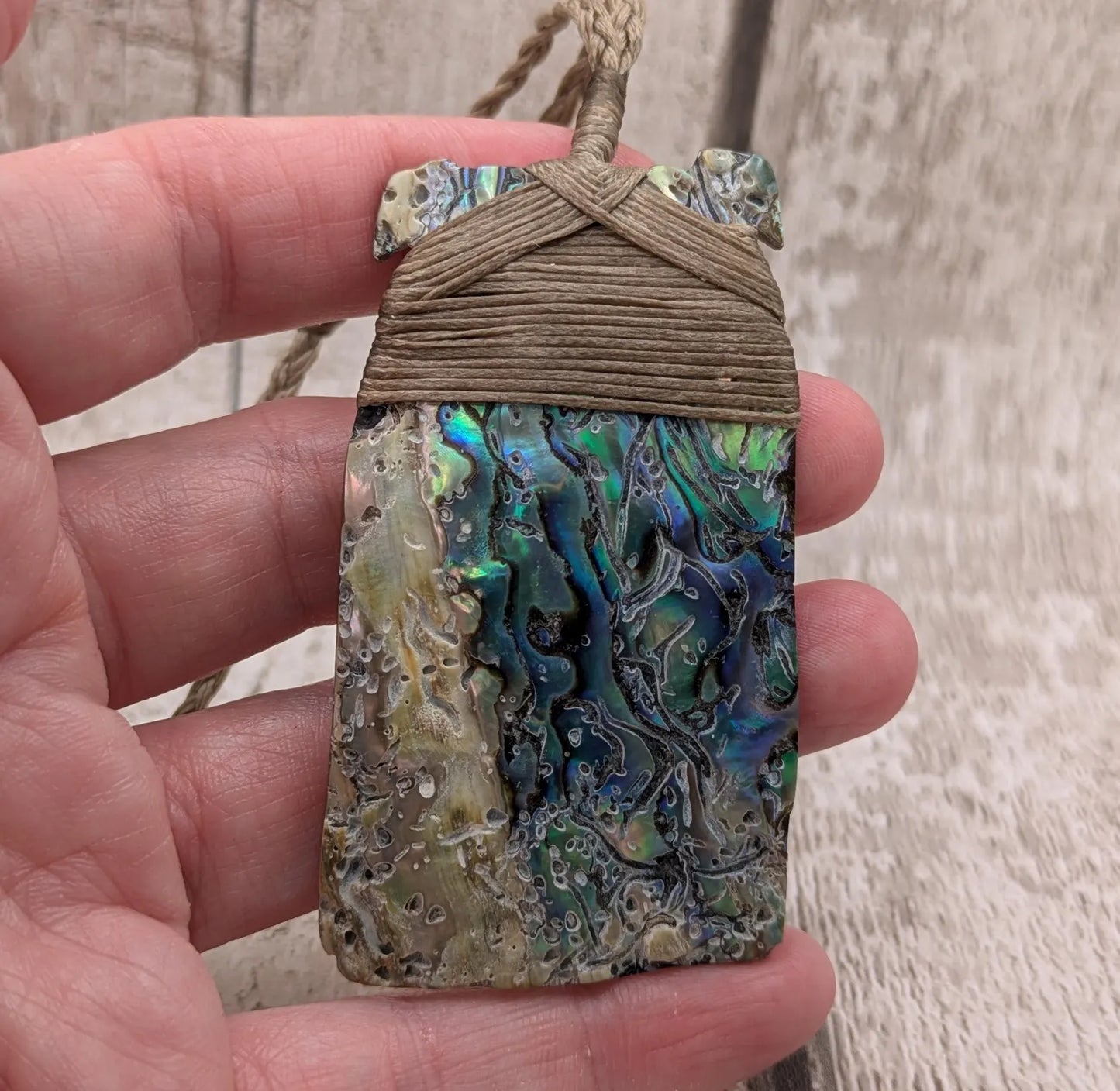 Wild New Zealand rainbow Pāua Hei Toki adze pendant