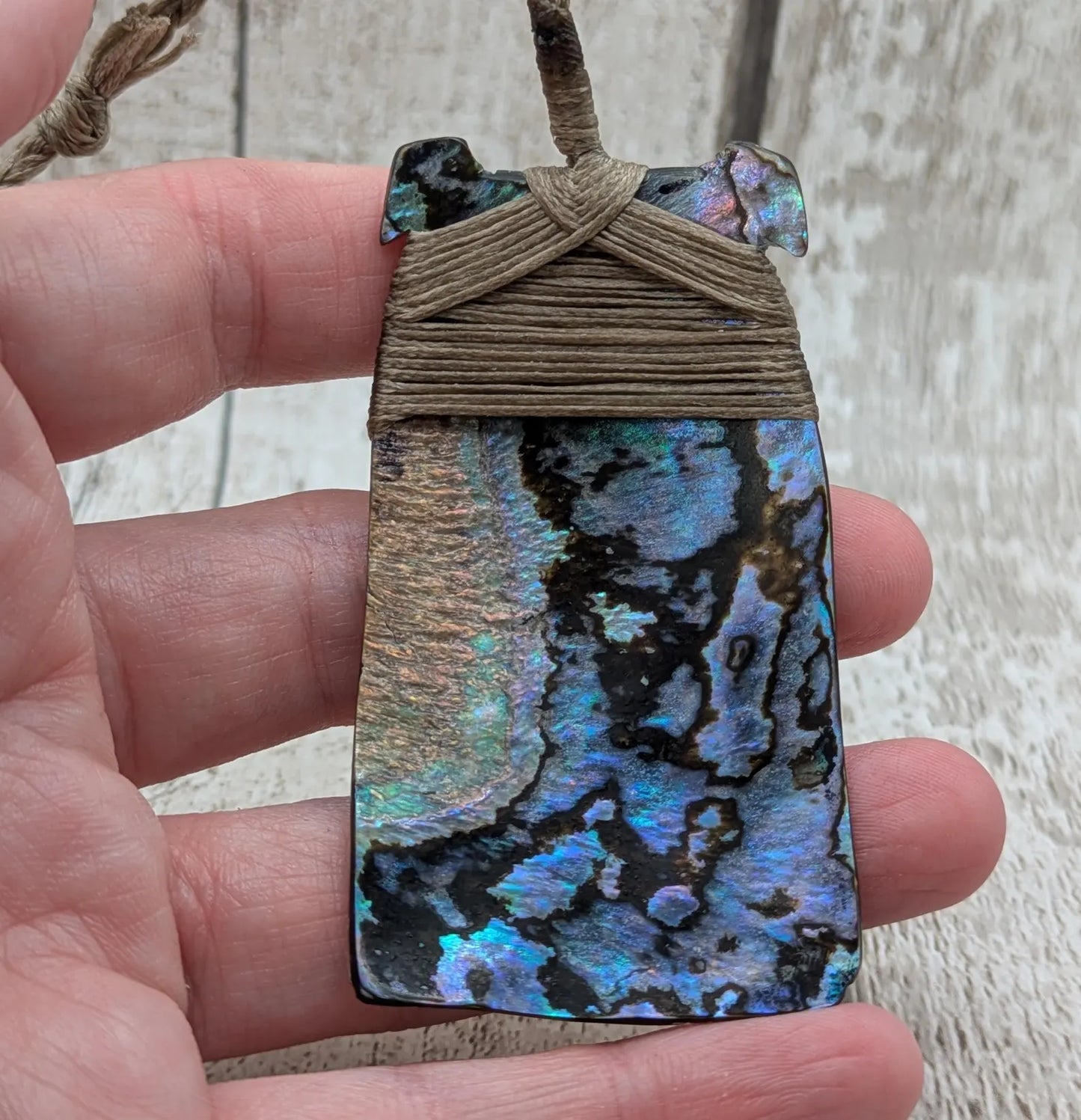 Wild New Zealand rainbow Pāua Hei Toki adze pendant