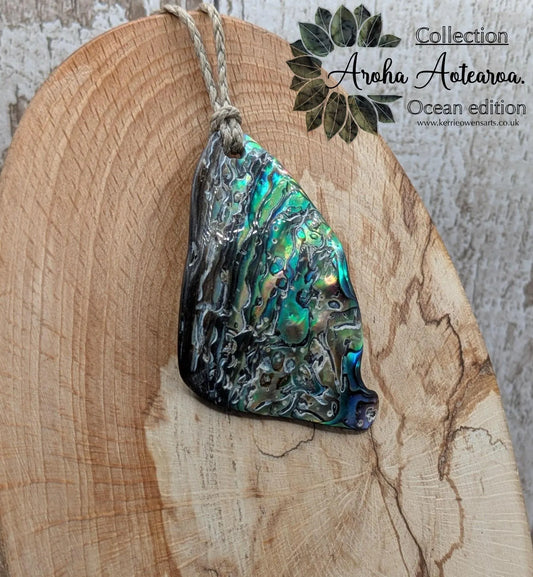 Wild natural tumbled New Zealand Pāua free form pendant.