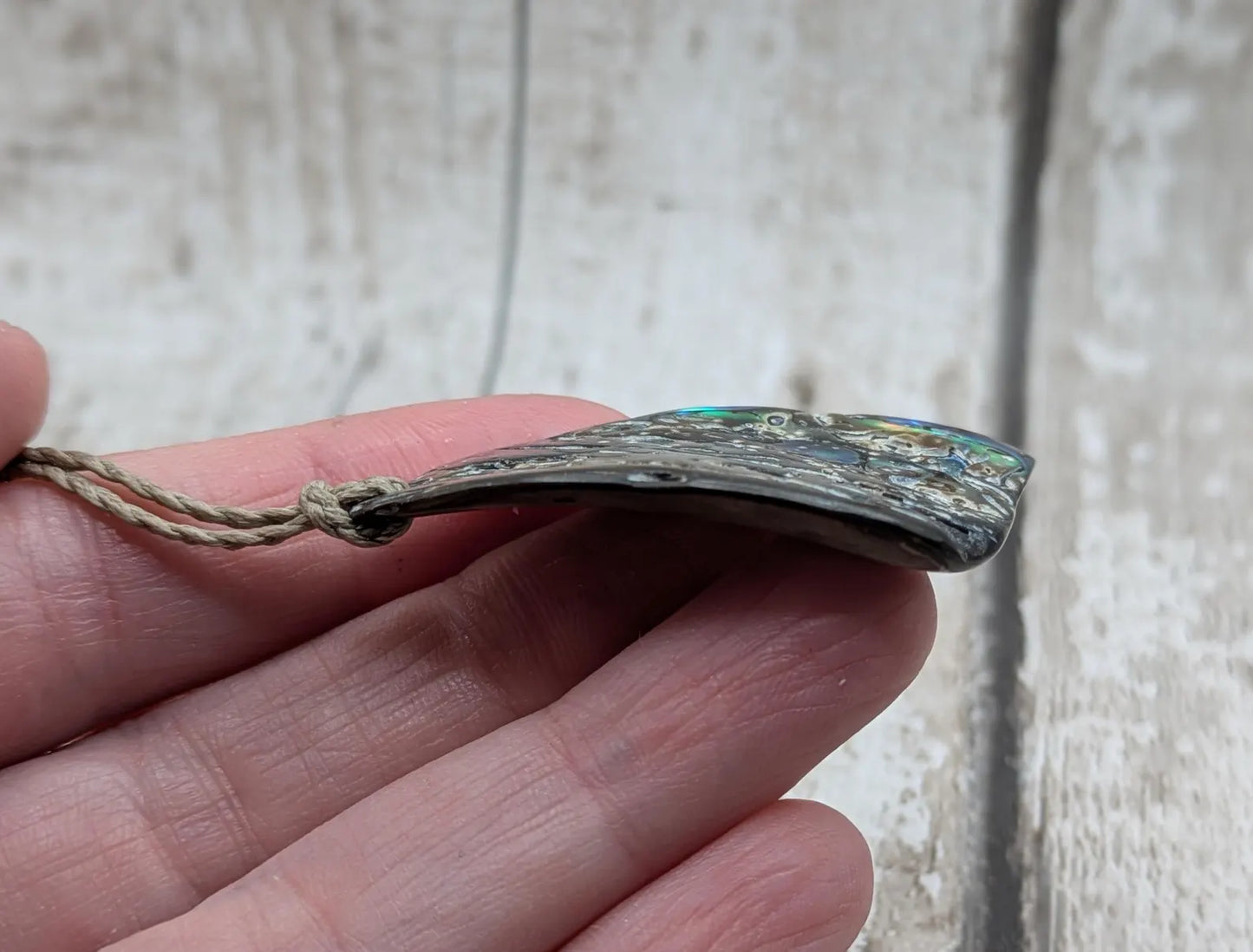 Wild natural tumbled New Zealand Pāua free form pendant.