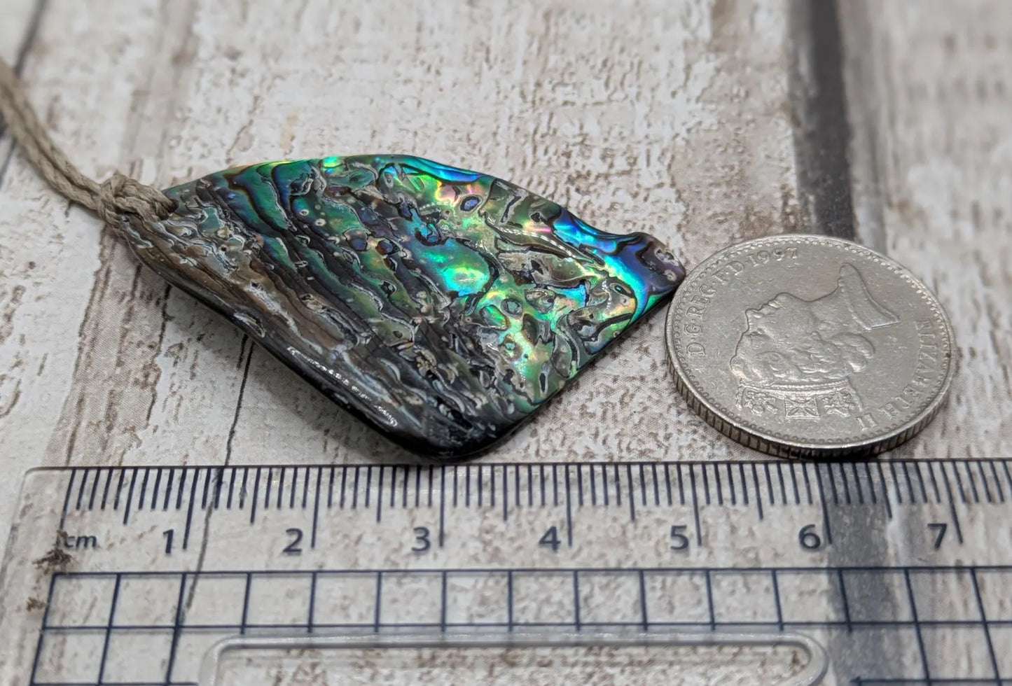 Wild natural tumbled New Zealand Pāua free form pendant.