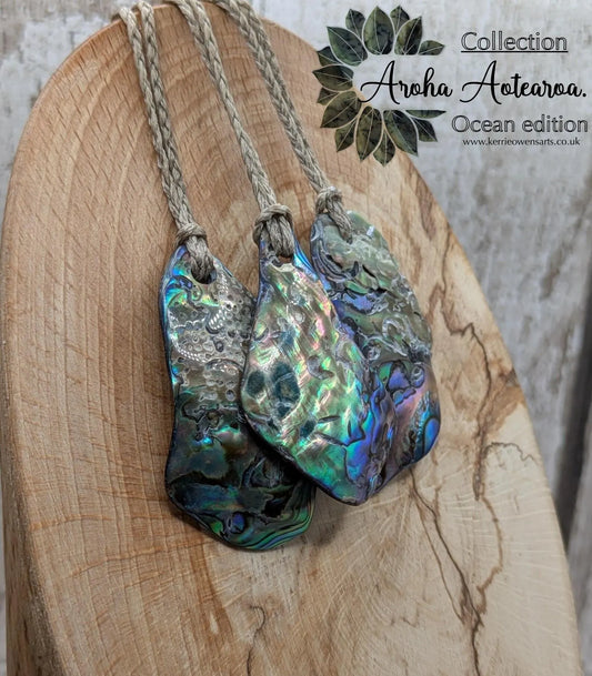 New Zealand free form wild tumbled rainbow Pāua pendant.