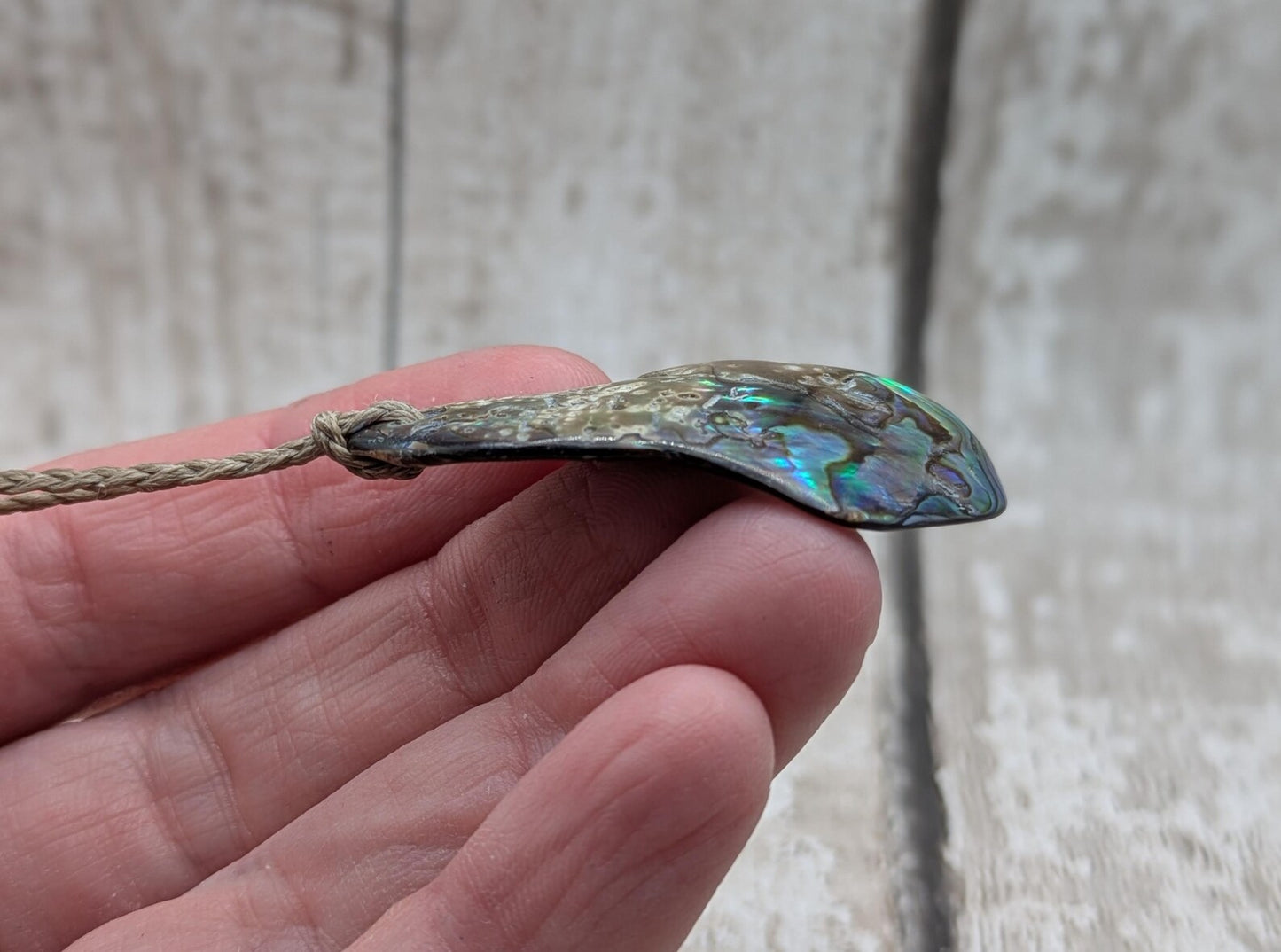 New Zealand free form wild tumbled rainbow Pāua pendant.
