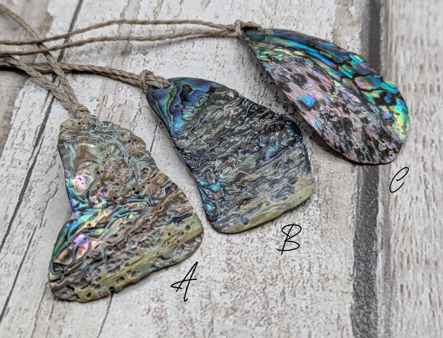 New Zealand free form naturally tumbled Pāua shell pendant.