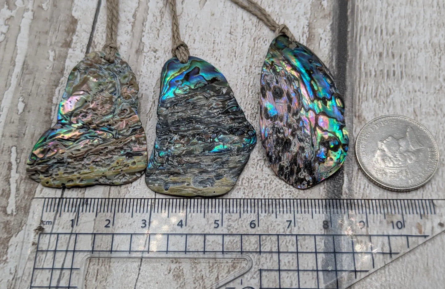 New Zealand free form naturally tumbled Pāua shell pendant.
