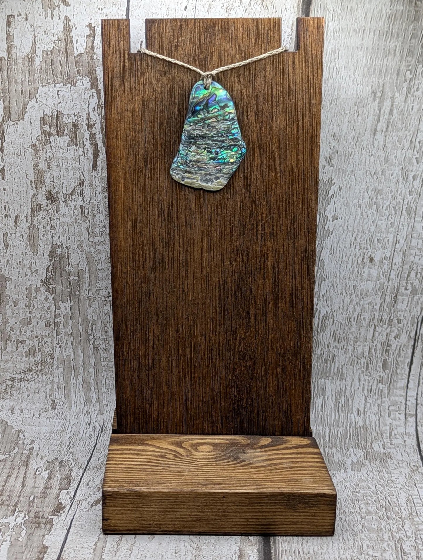 New Zealand free form naturally tumbled Pāua shell pendant.