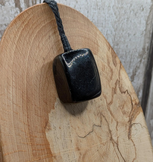 Tumble polished Whitby jet.