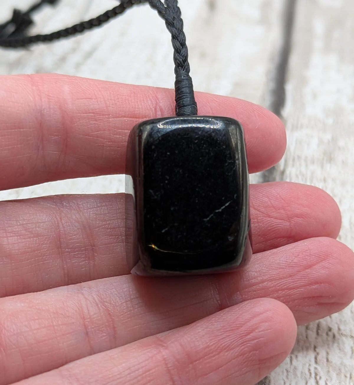 Tumble polished Whitby jet.