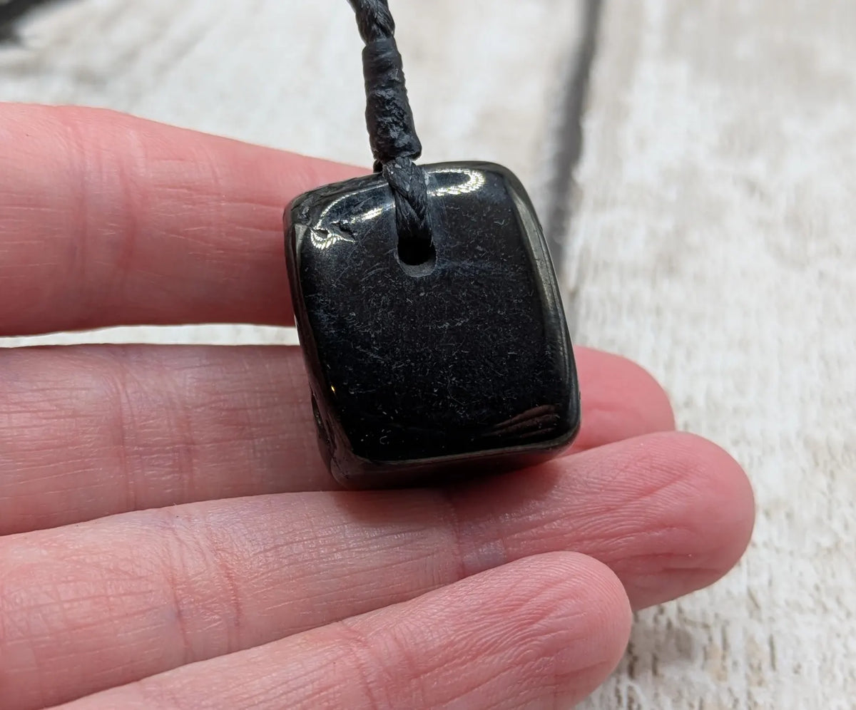 Tumble polished Whitby jet.