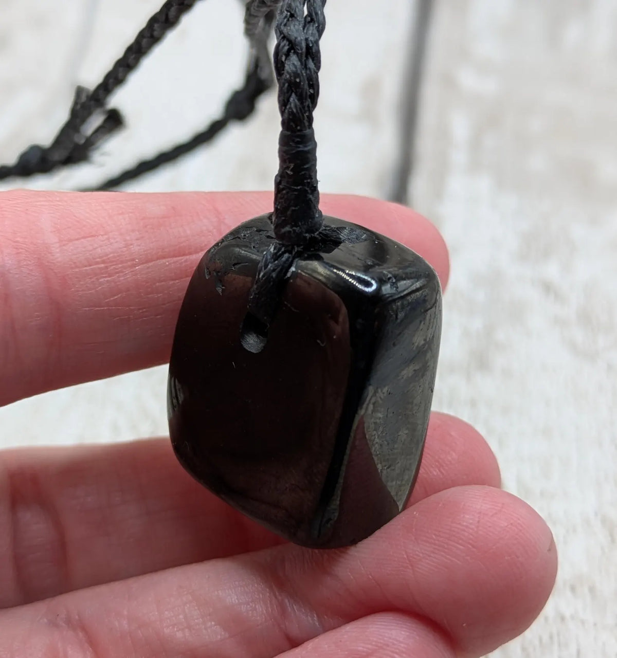 Tumble polished Whitby jet.