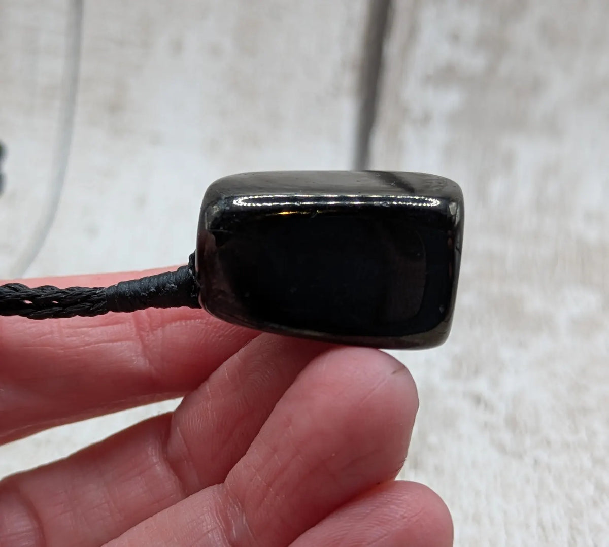 Tumble polished Whitby jet.