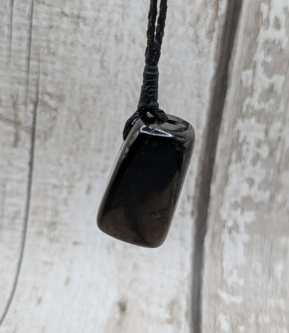 Tumble polished Whitby jet.