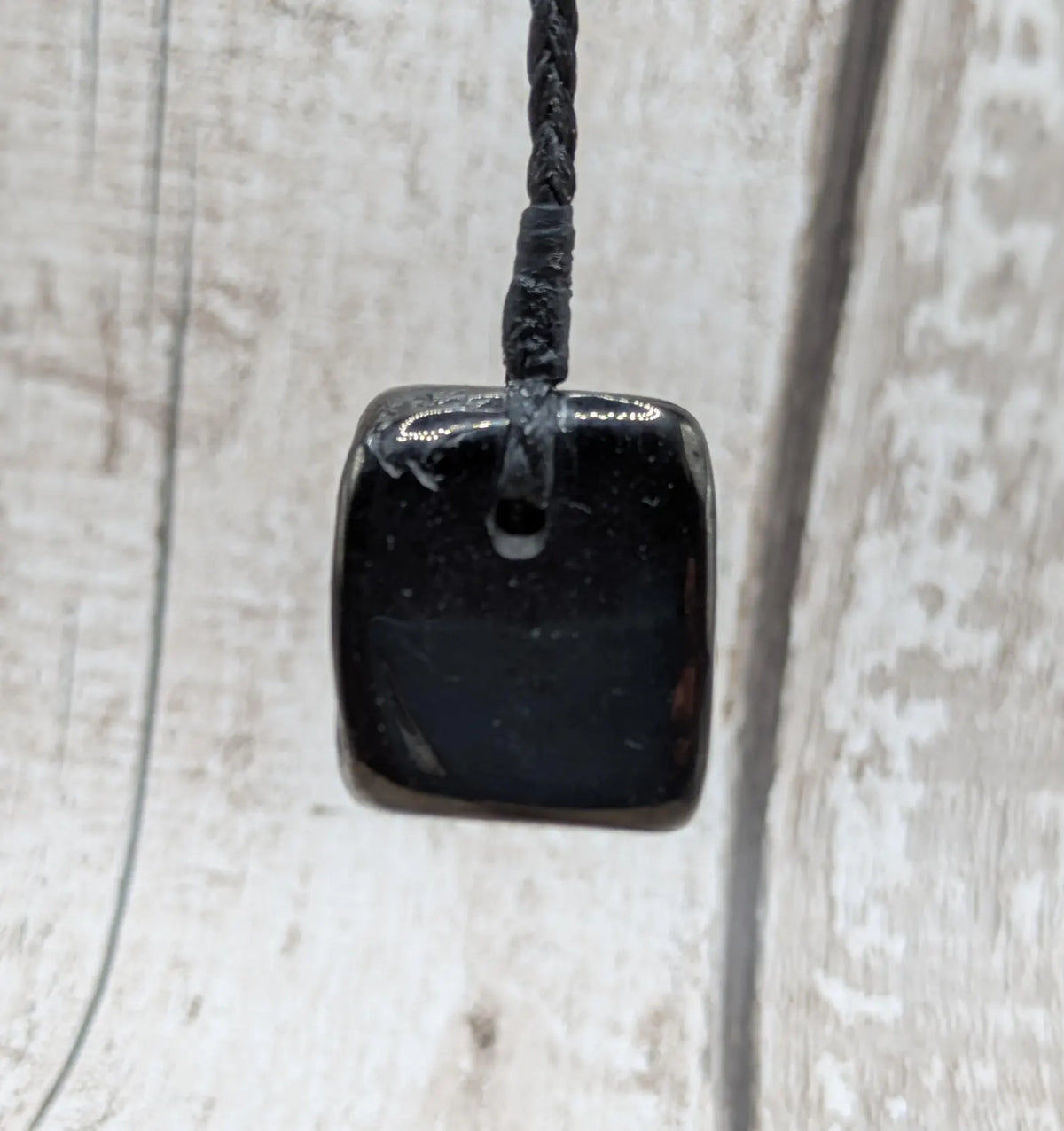 Tumble polished Whitby jet.