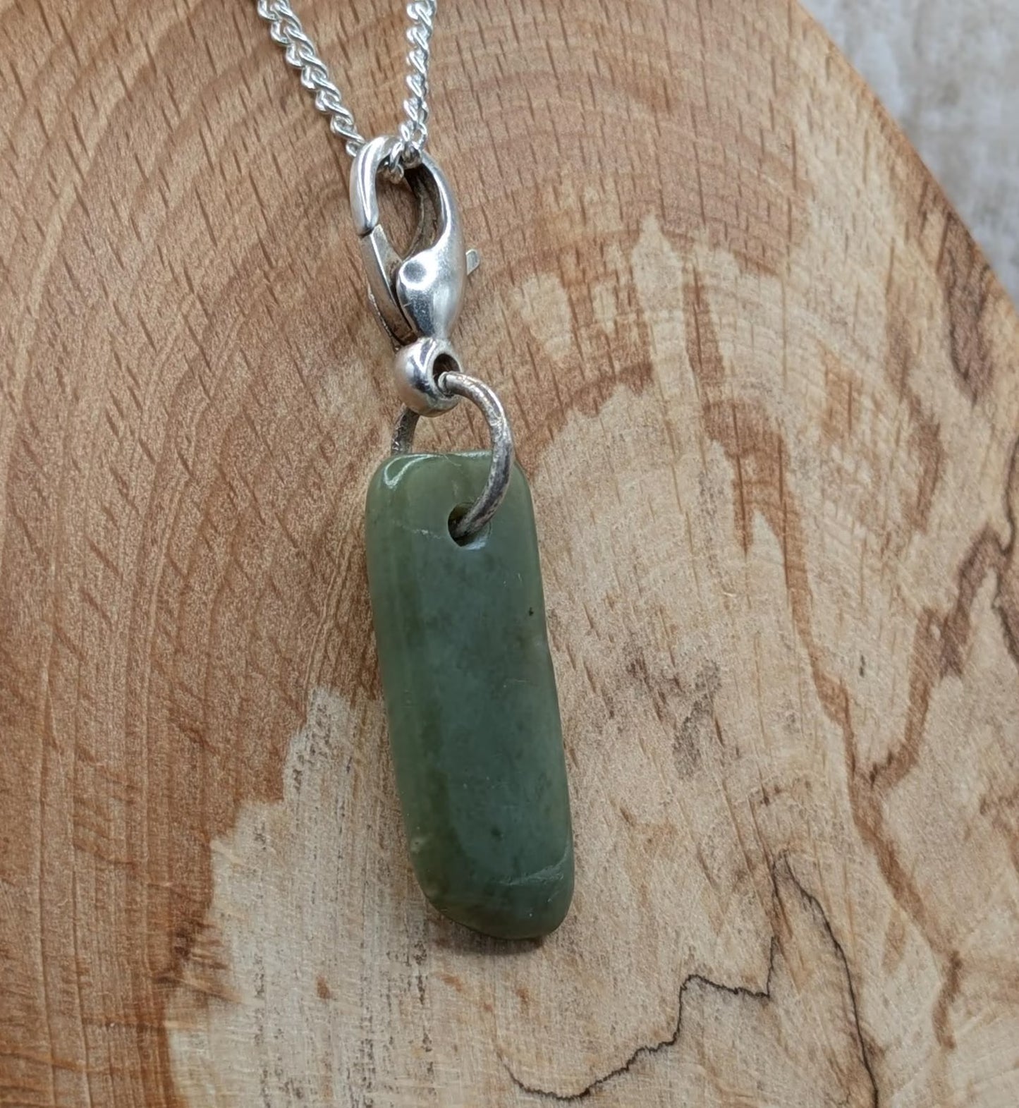 Tumbled New Zealand Pounamu greenstone jade clip on jewellery charm.