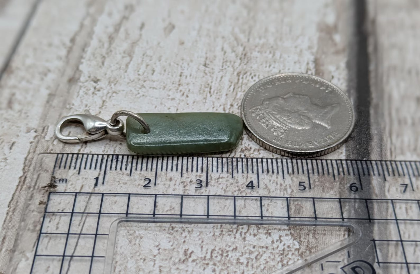 Tumbled New Zealand Pounamu greenstone jade clip on jewellery charm.