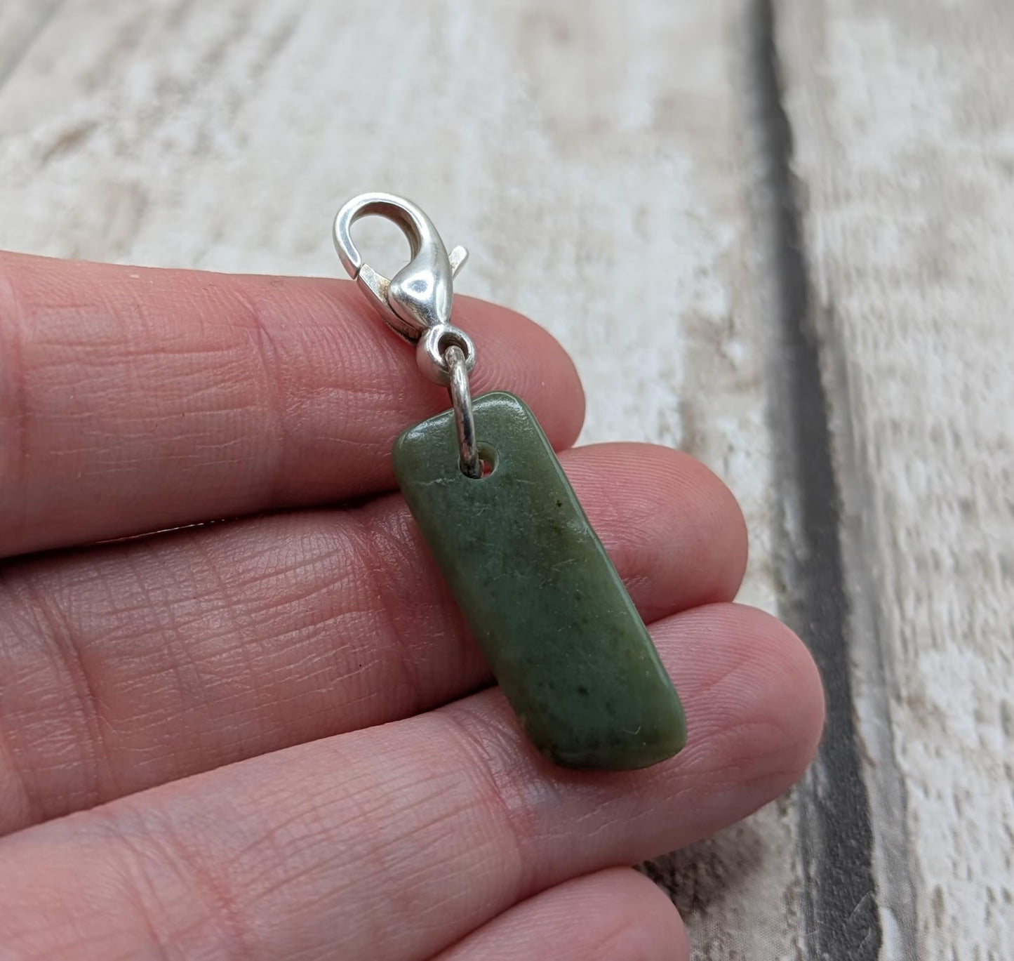 Tumbled New Zealand Pounamu greenstone jade clip on jewellery charm.