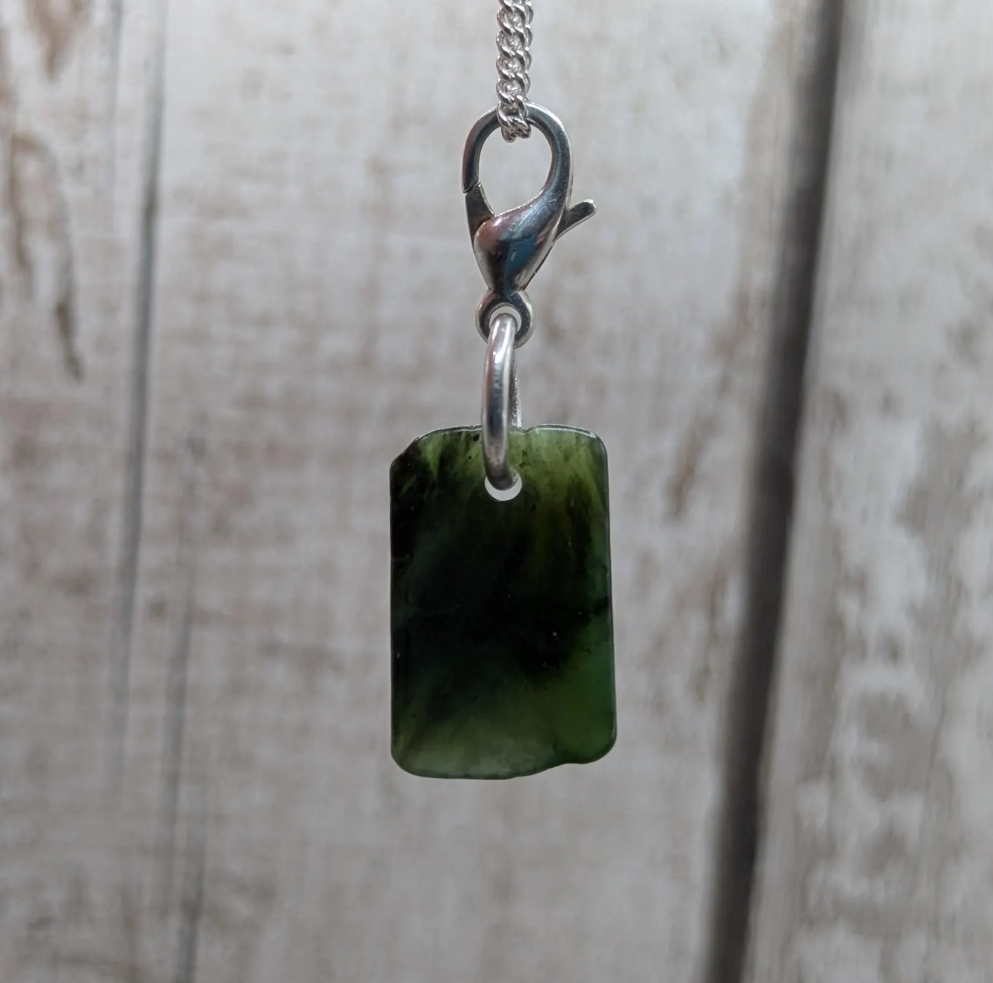Tumbled New Zealand Pounamu greenstone jade clip on jewellery charm.