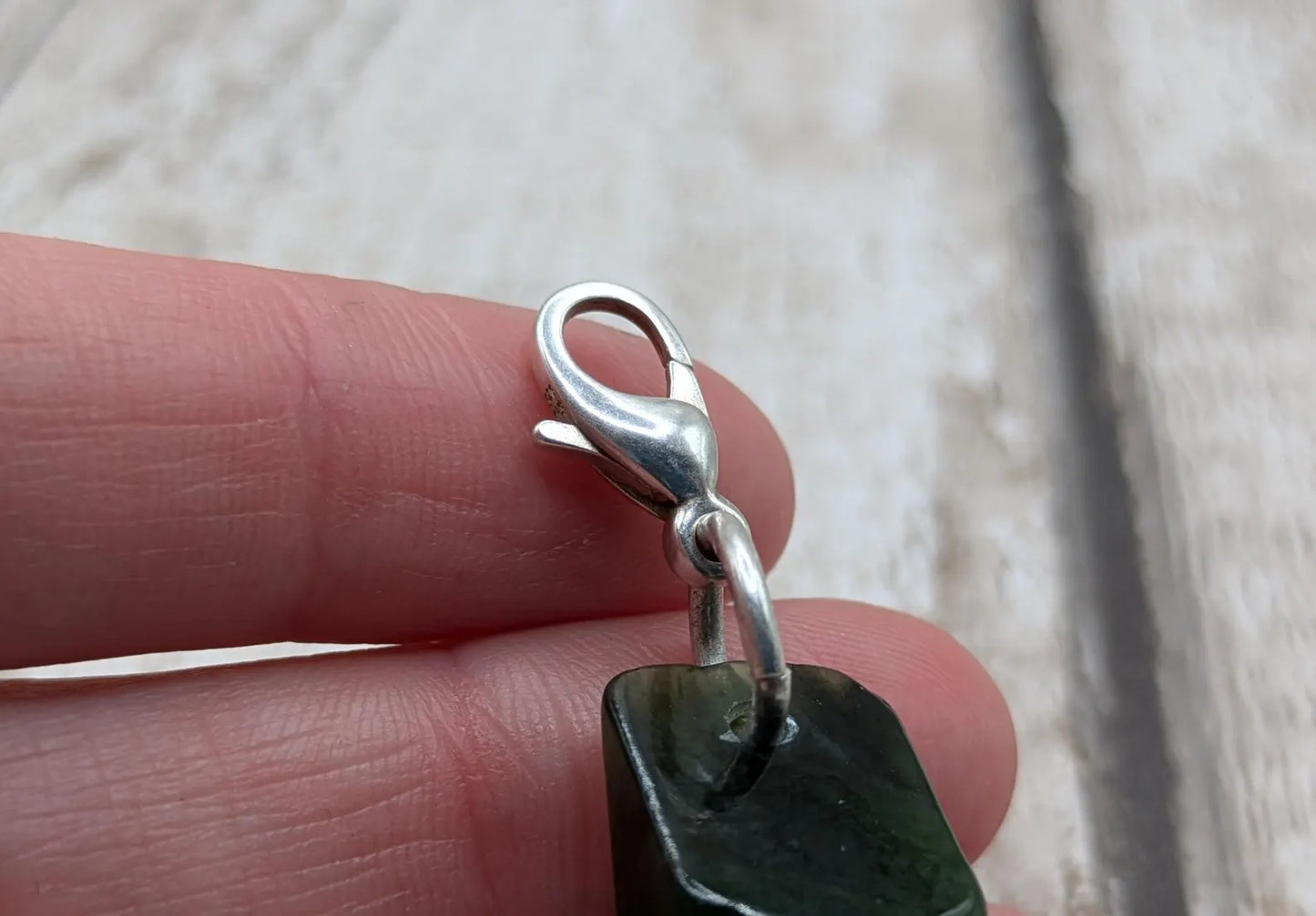 Tumbled New Zealand Pounamu greenstone jade clip on jewellery charm.