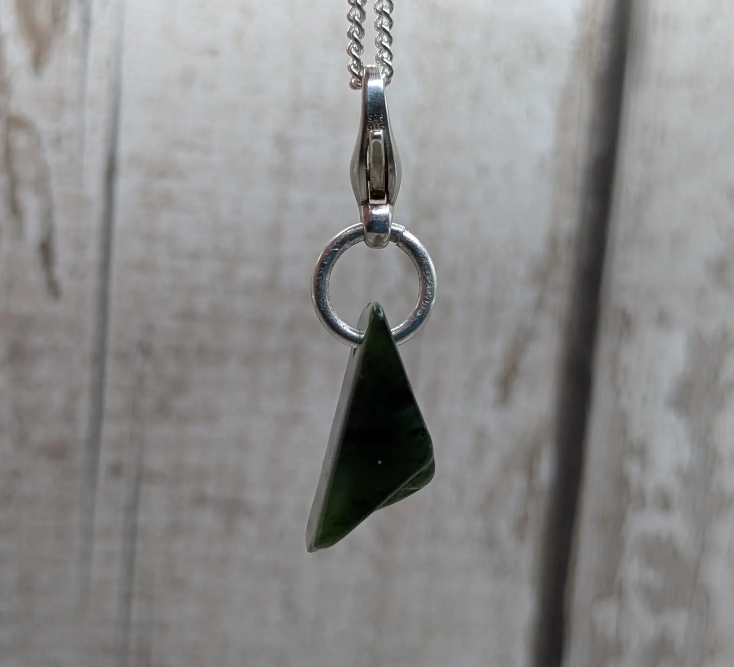 Tumbled New Zealand Pounamu greenstone jade clip on jewellery charm.