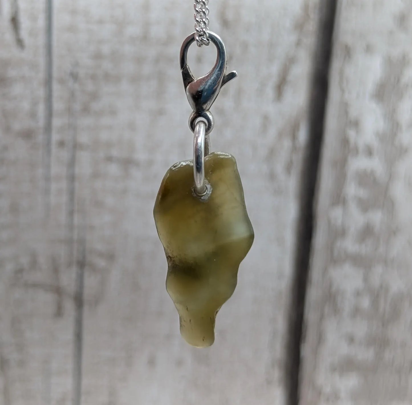 Tumbled New Zealand Pounamu greenstone jade clip on jewellery charm.