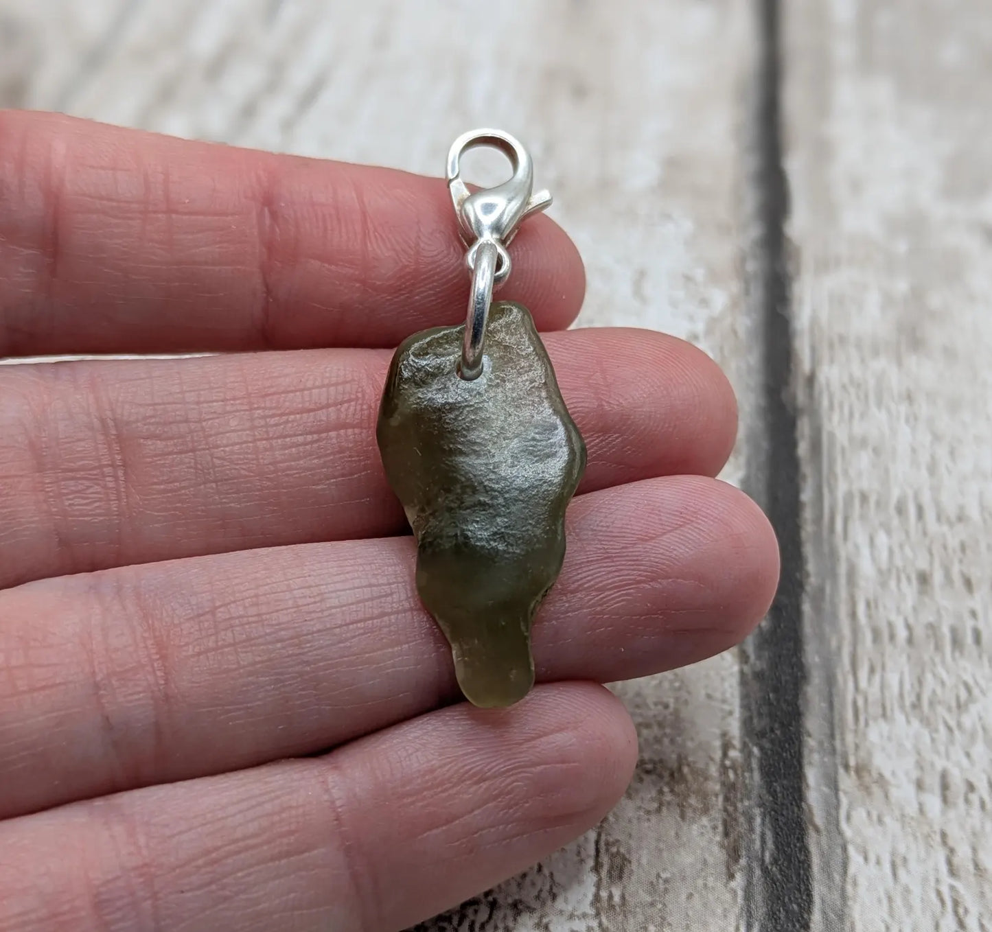 Tumbled New Zealand Pounamu greenstone jade clip on jewellery charm.