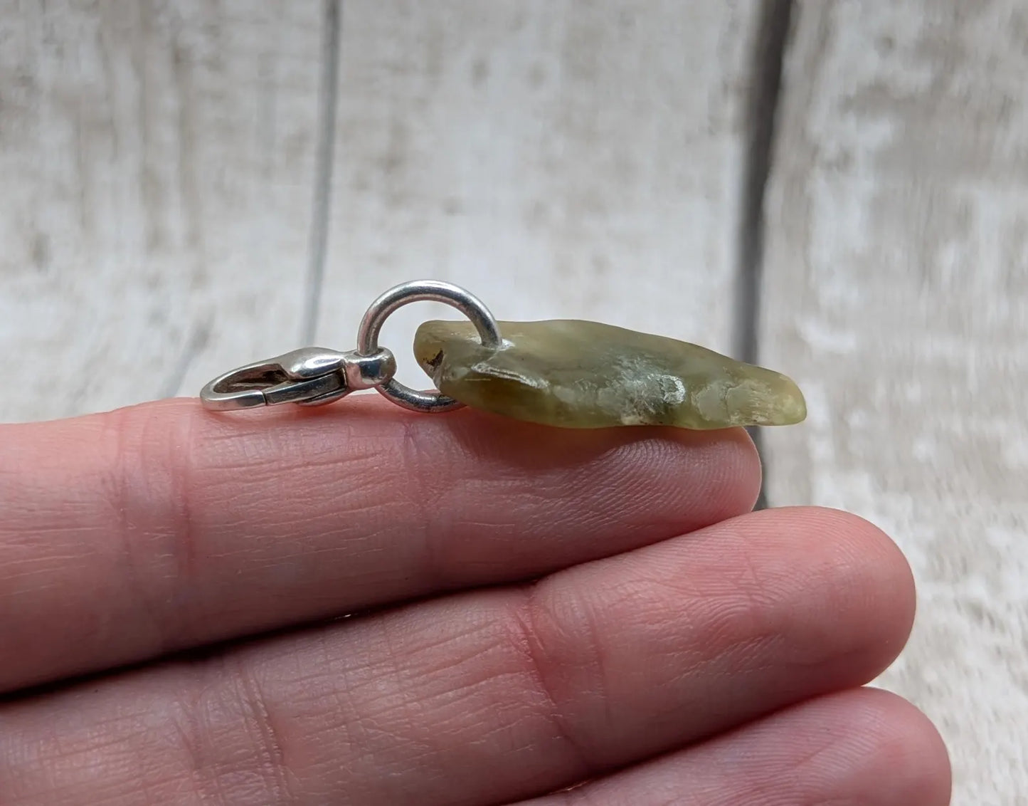 Tumbled New Zealand Pounamu greenstone jade clip on jewellery charm.