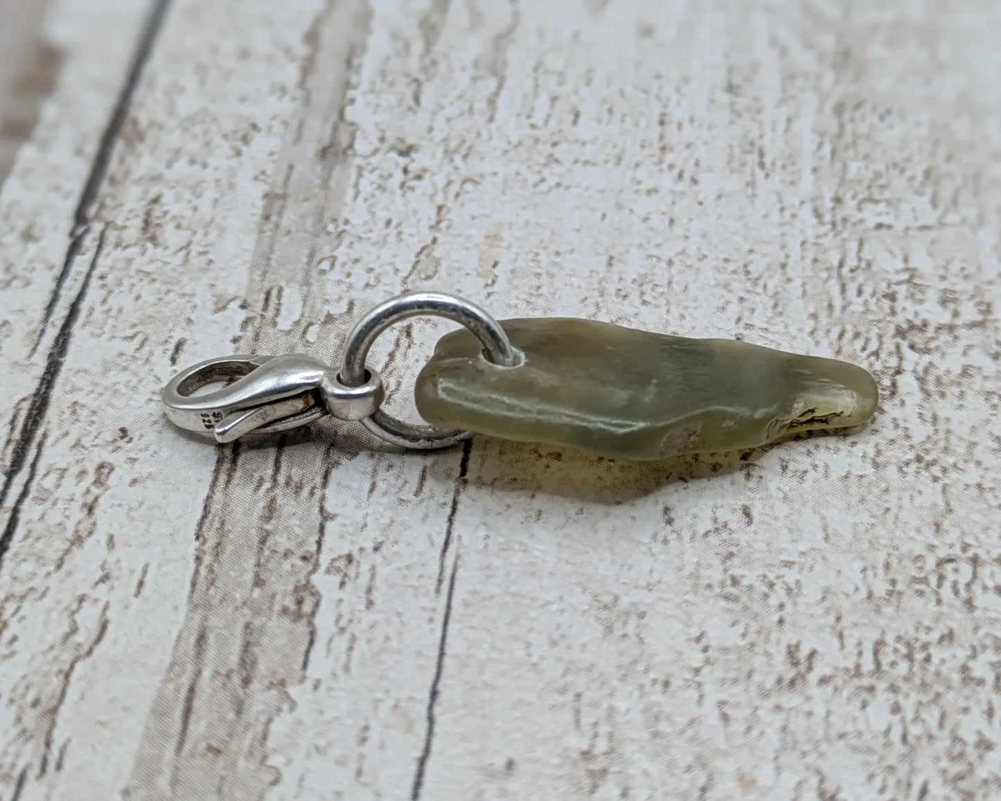 Tumbled New Zealand Pounamu greenstone jade clip on jewellery charm.