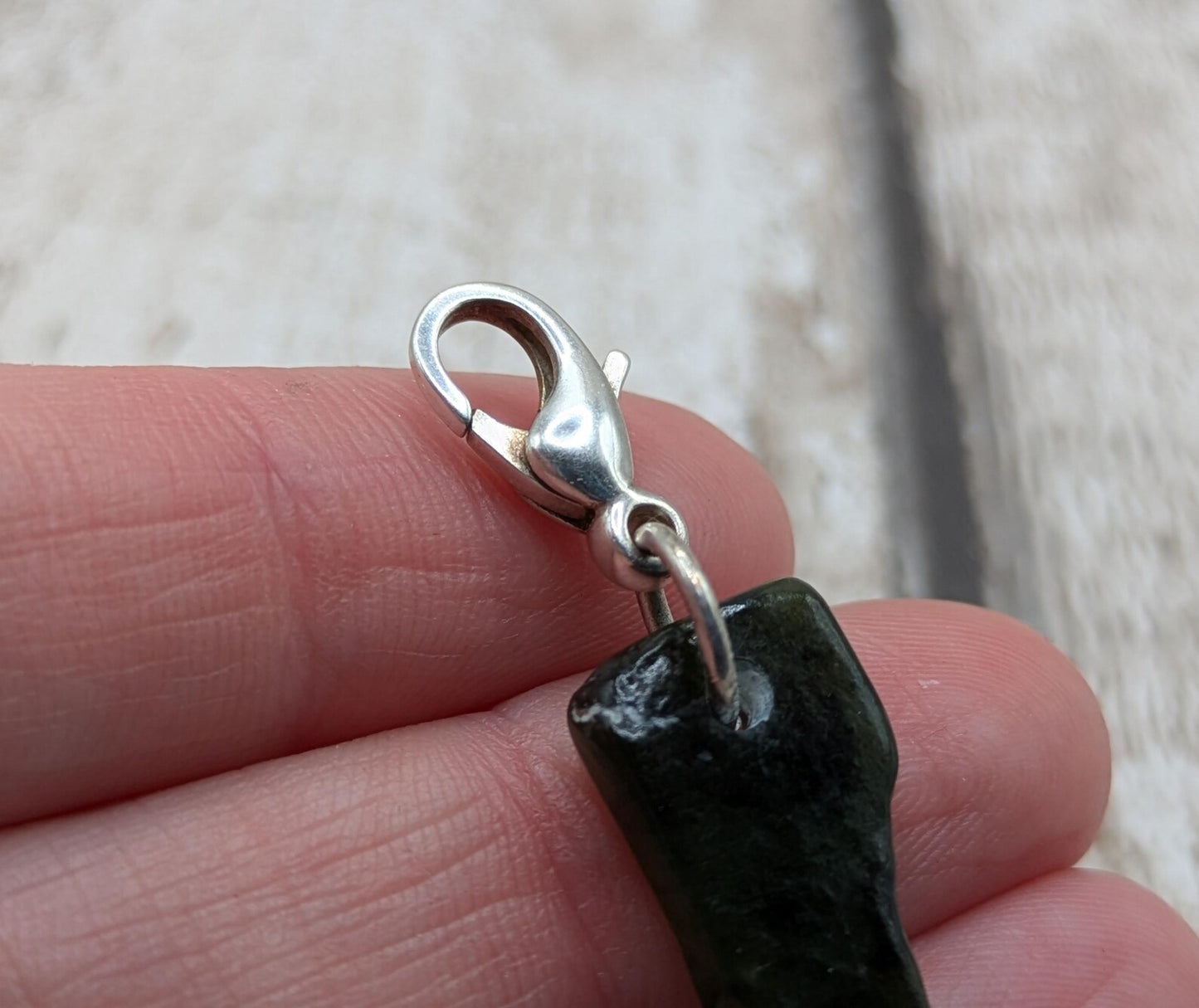 Tumbled New Zealand Pounamu greenstone jade clip on charm.