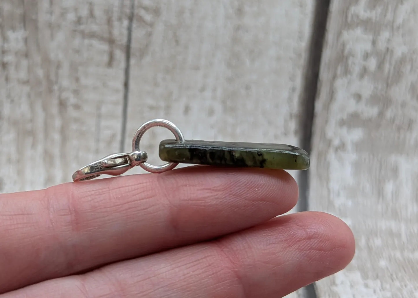Tumbled New Zealand Pounamu greenstone jade clip on jewellery charm.