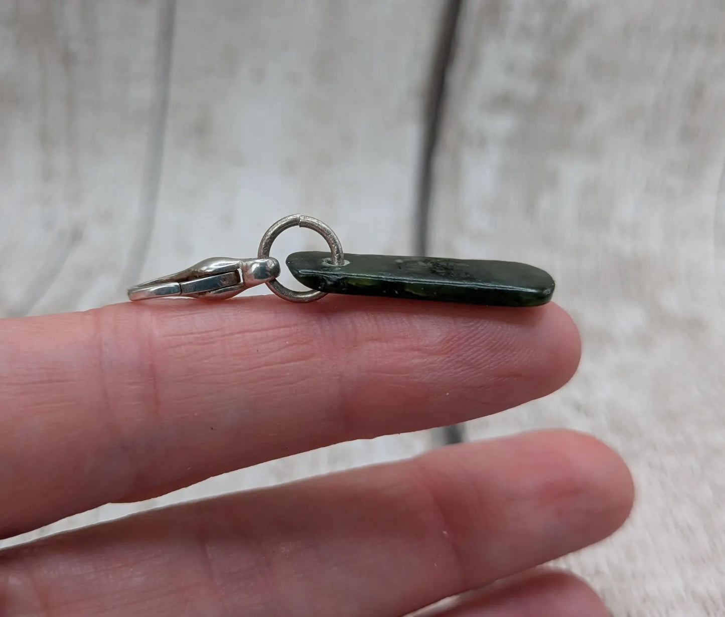 Tumbled New Zealand Pounamu jade clip on jewellery charm.