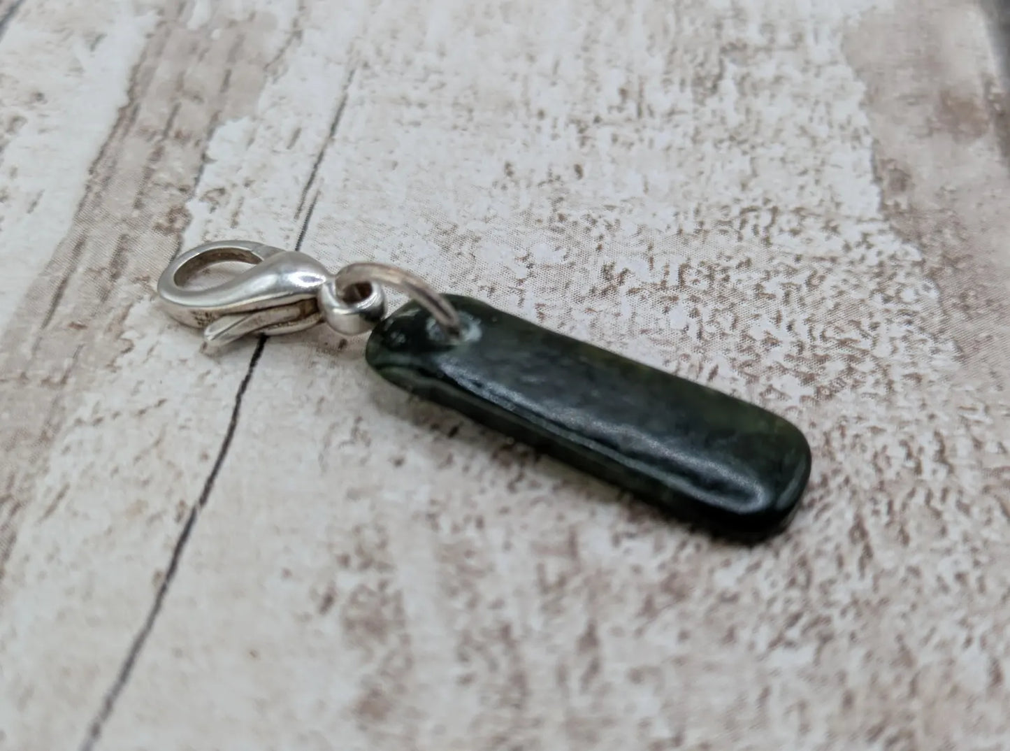Tumbled New Zealand Pounamu jade clip on jewellery charm.