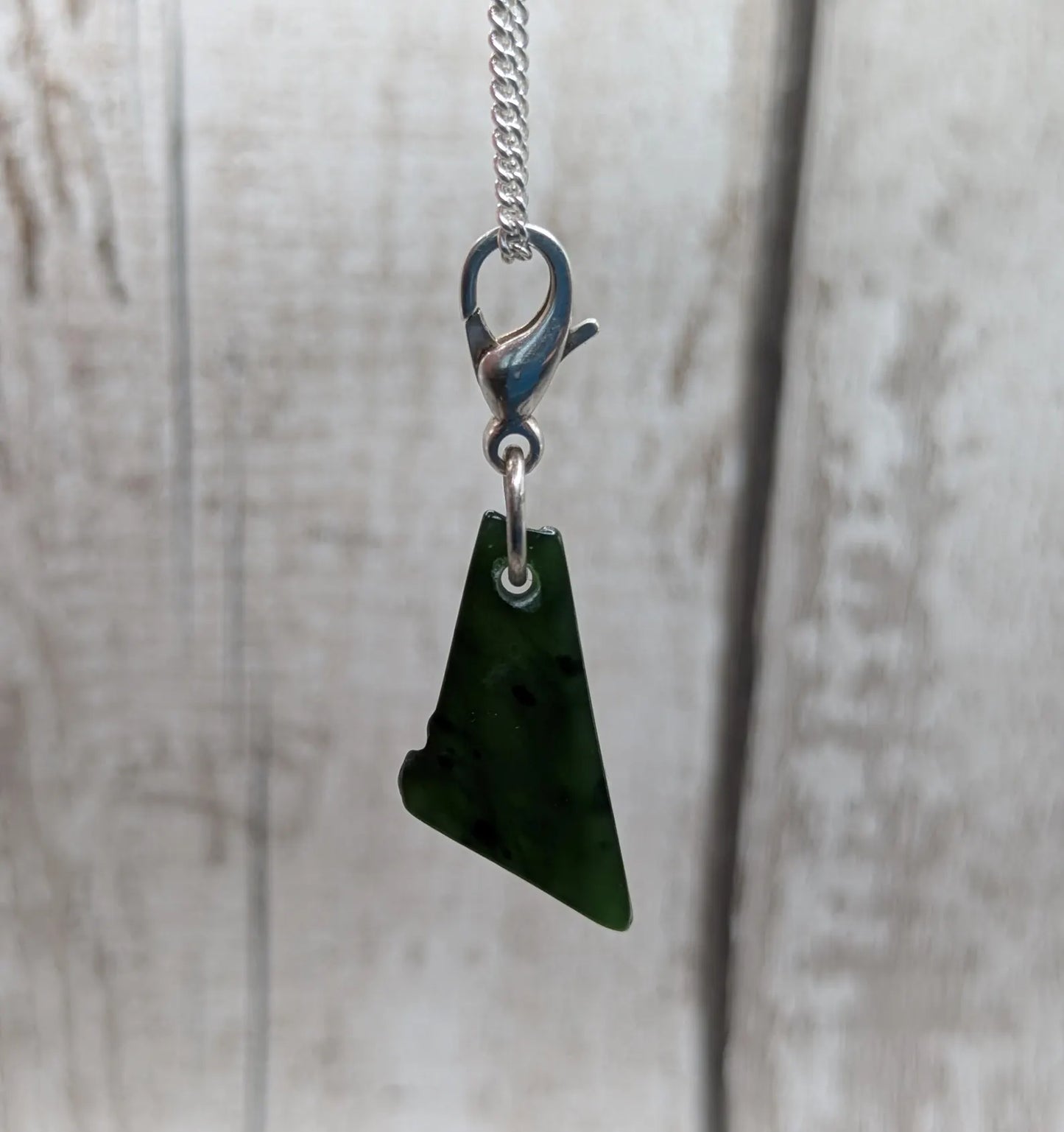 Tumbled New Zealand Pounamu greenstone jade clip on jewellery charm.