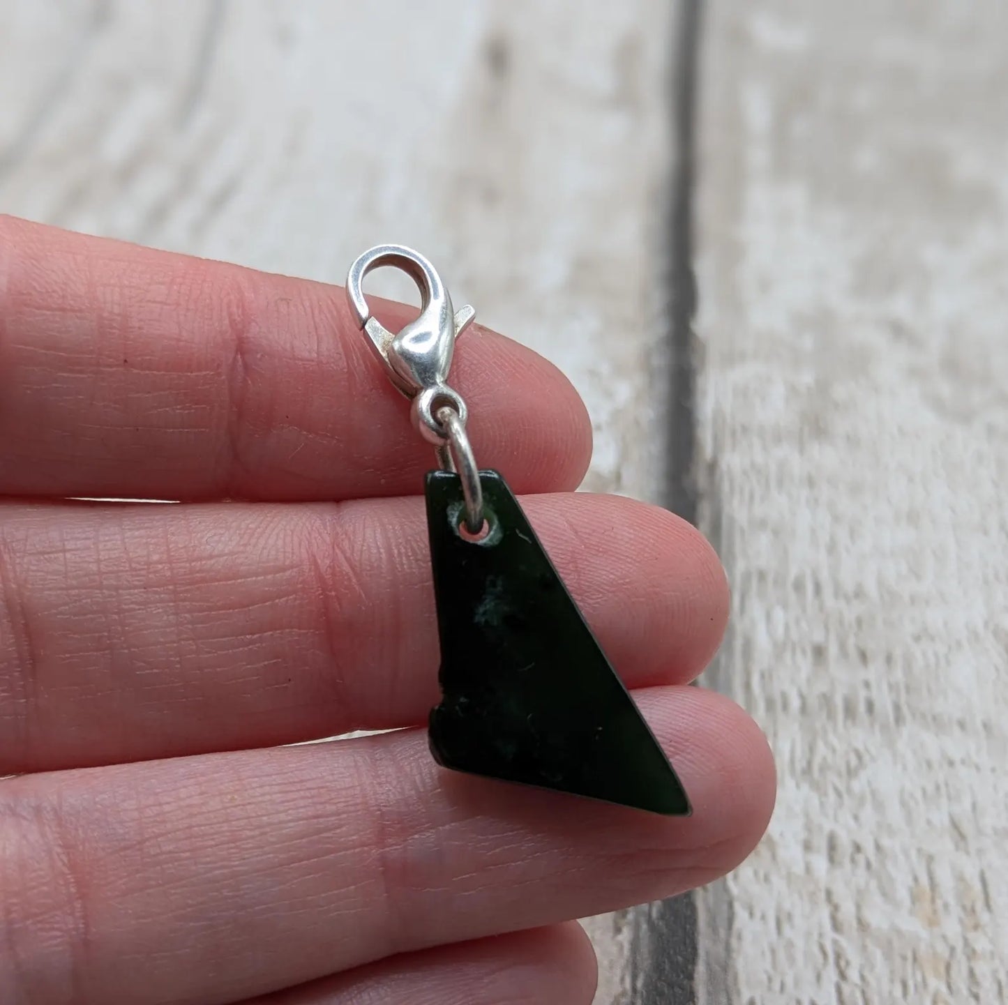 Tumbled New Zealand Pounamu greenstone jade clip on jewellery charm.