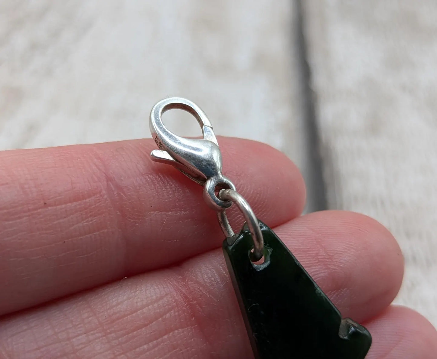 Tumbled New Zealand Pounamu greenstone jade clip on jewellery charm.
