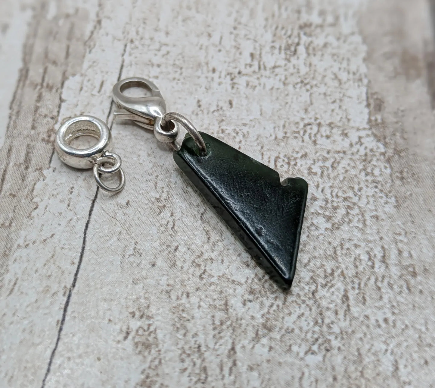 Tumbled New Zealand Pounamu greenstone jade clip on jewellery charm.