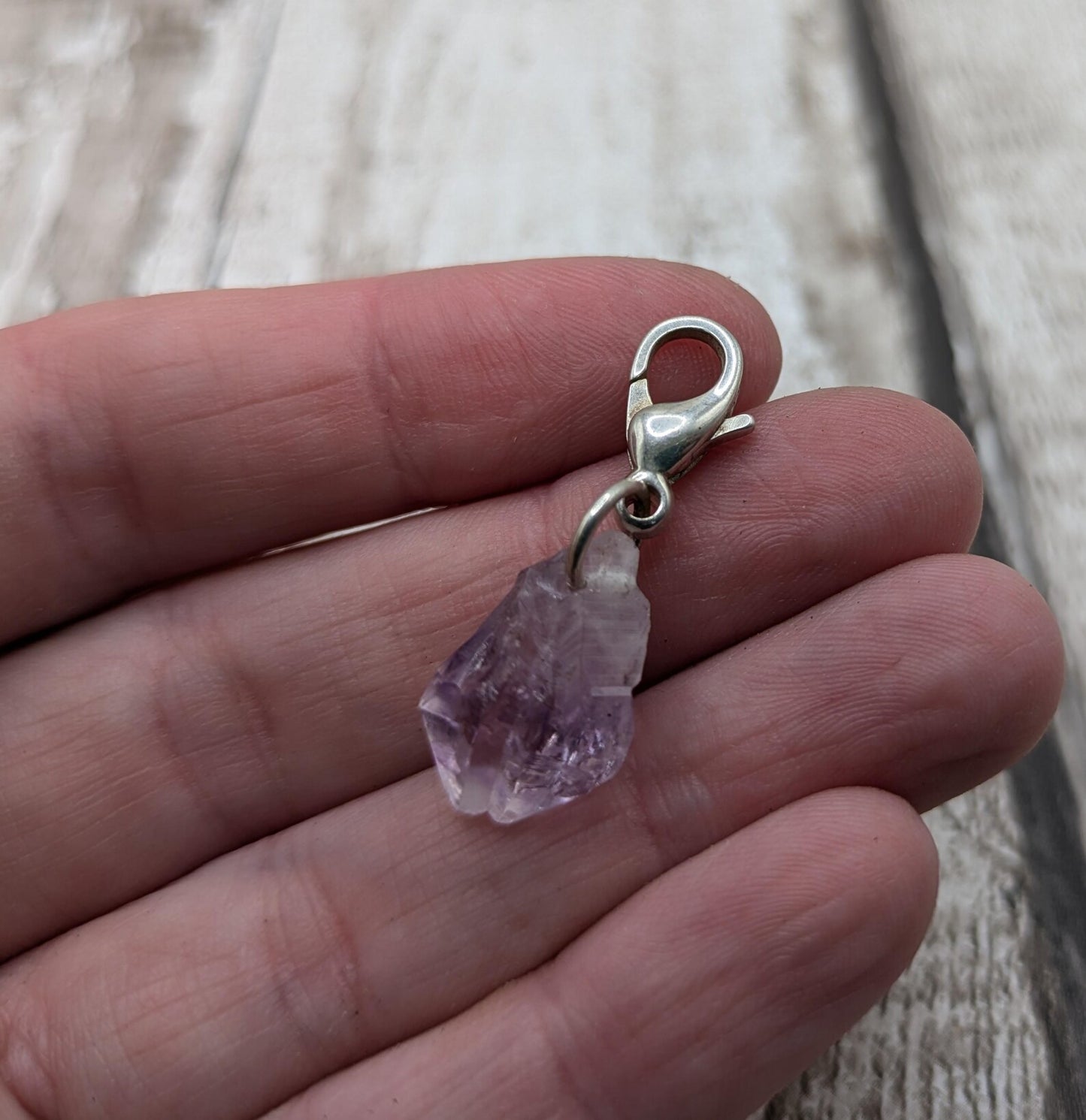 Raw amethyst point clip on charm.