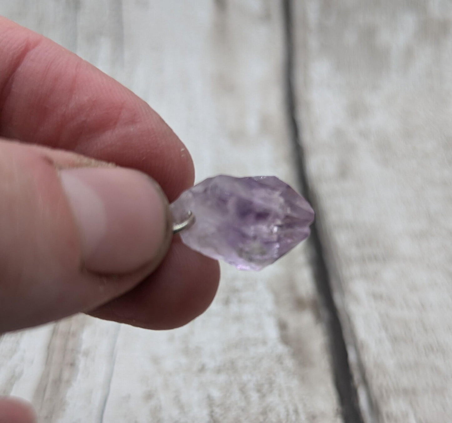 Raw amethyst point clip on charm.