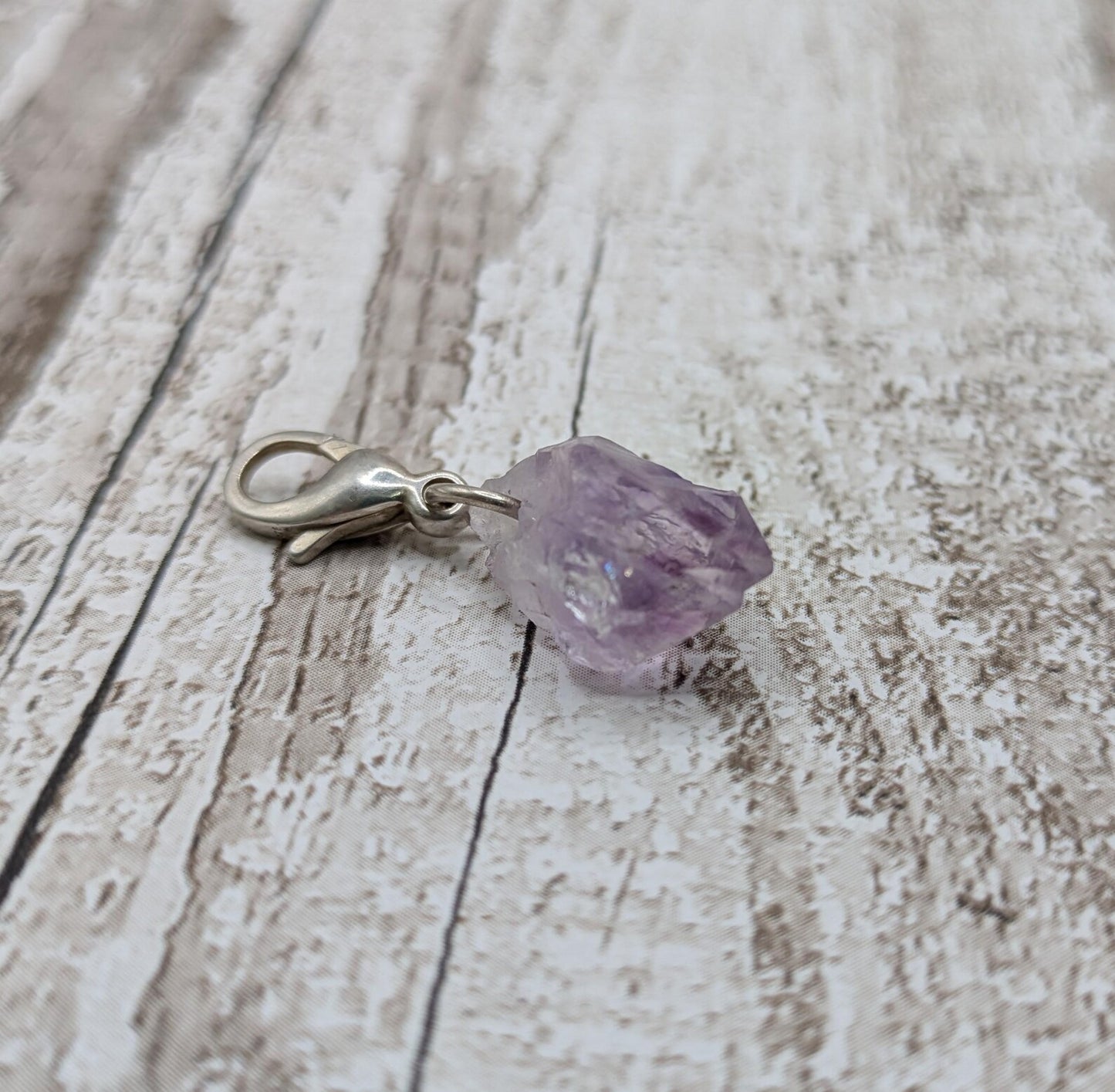 Raw amethyst point clip on charm.