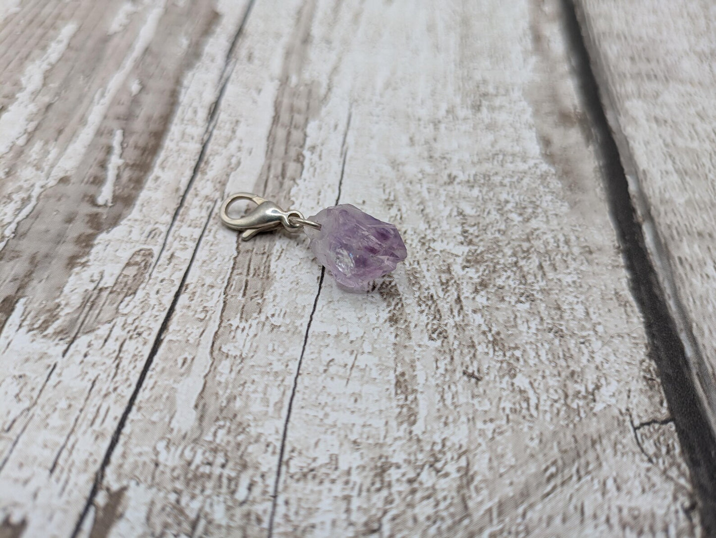 Raw amethyst point clip on charm.