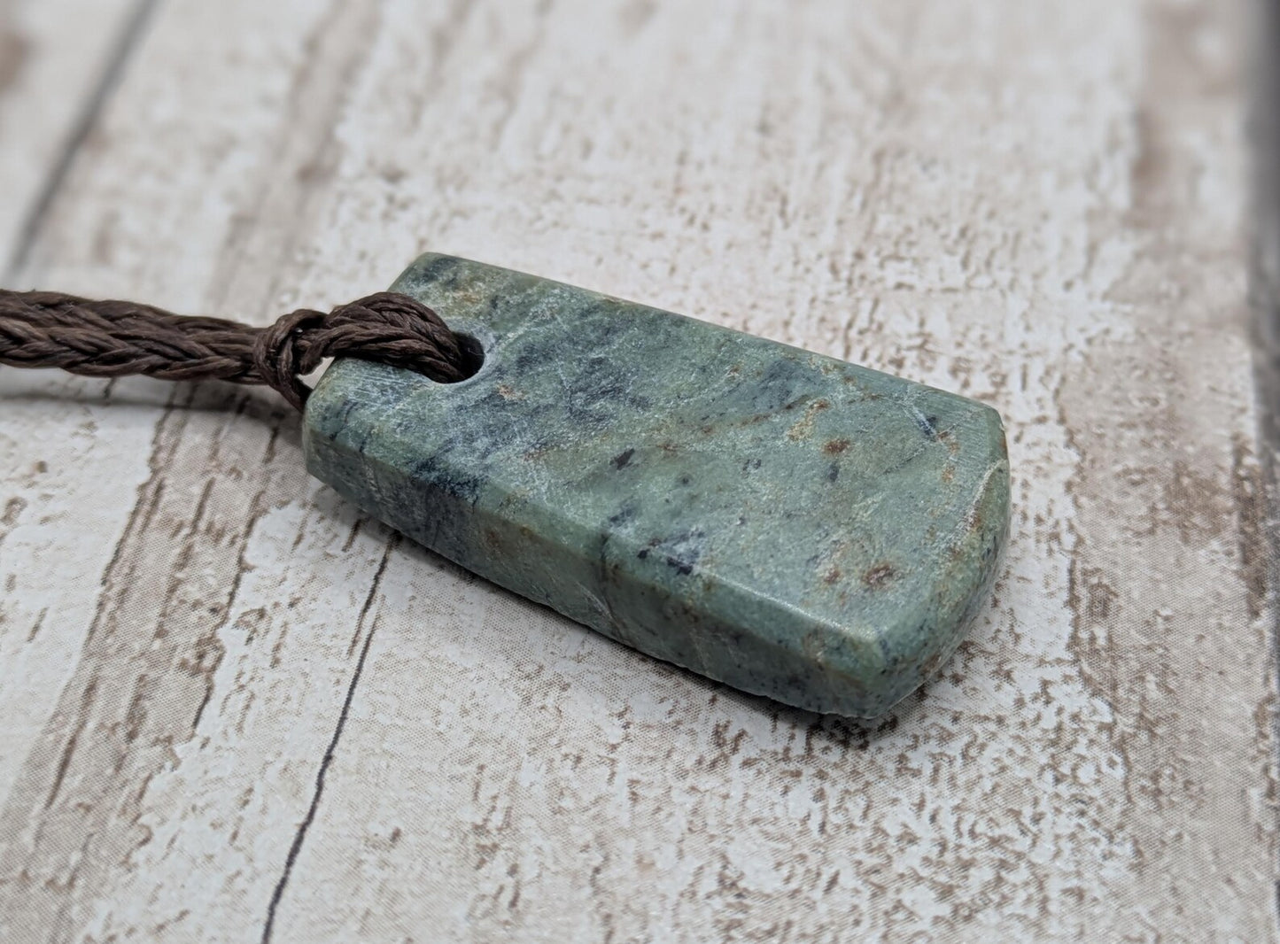 new Zealand pounamu greenstone jade pendant Off cut slice, raw weathered back, cultural and spiritual amulet.