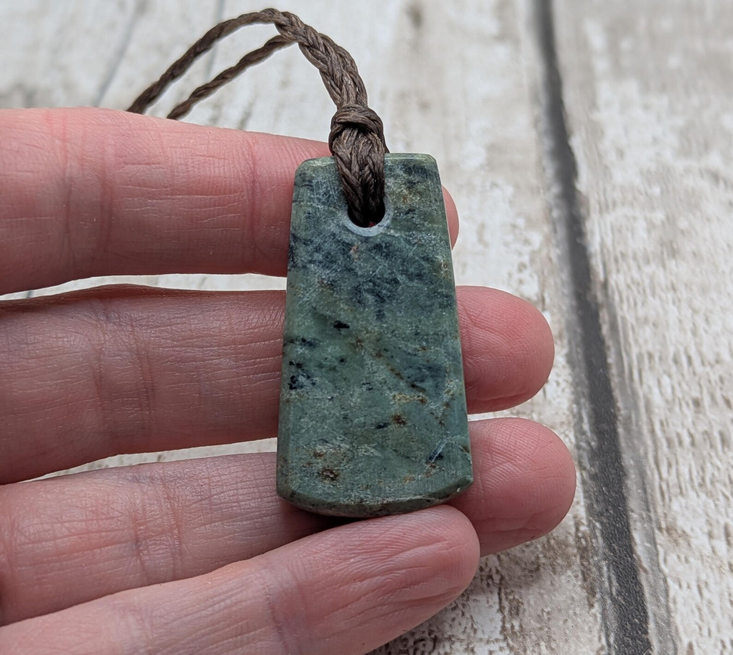 new Zealand pounamu greenstone jade pendant Off cut slice, raw weathered back, cultural and spiritual amulet.
