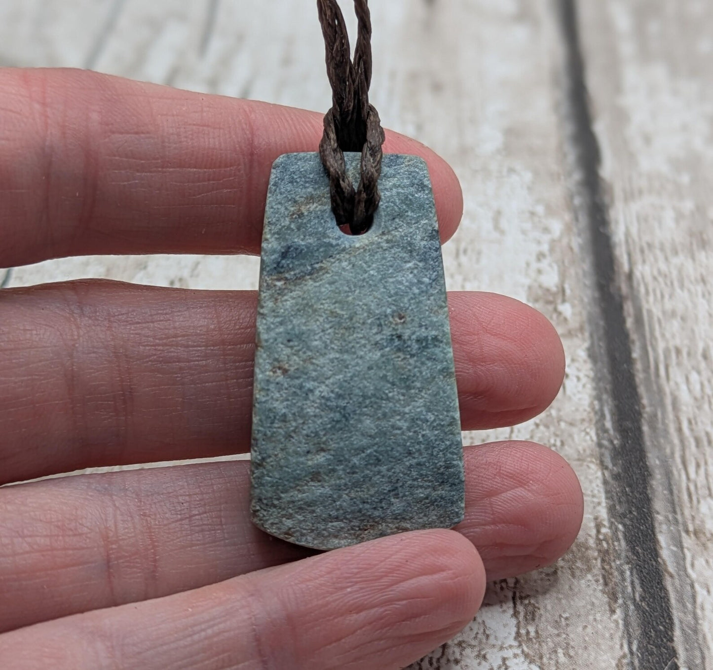 new Zealand pounamu greenstone jade pendant Off cut slice, raw weathered back, cultural and spiritual amulet.