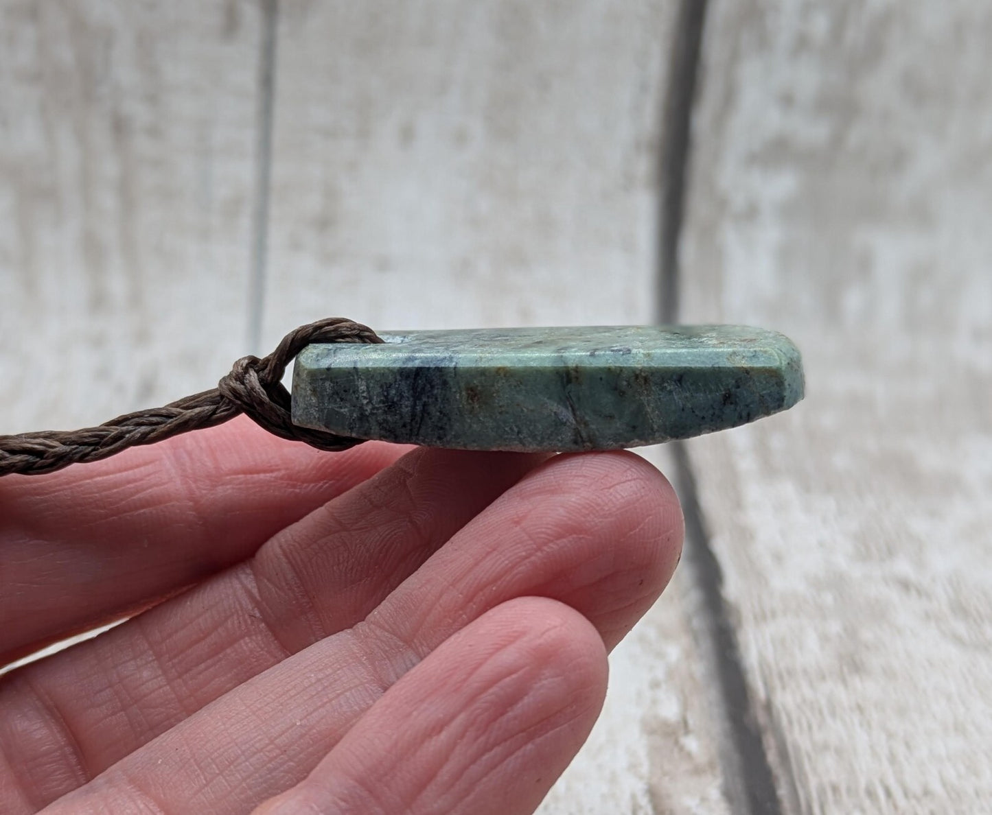 new Zealand pounamu greenstone jade pendant Off cut slice, raw weathered back, cultural and spiritual amulet.