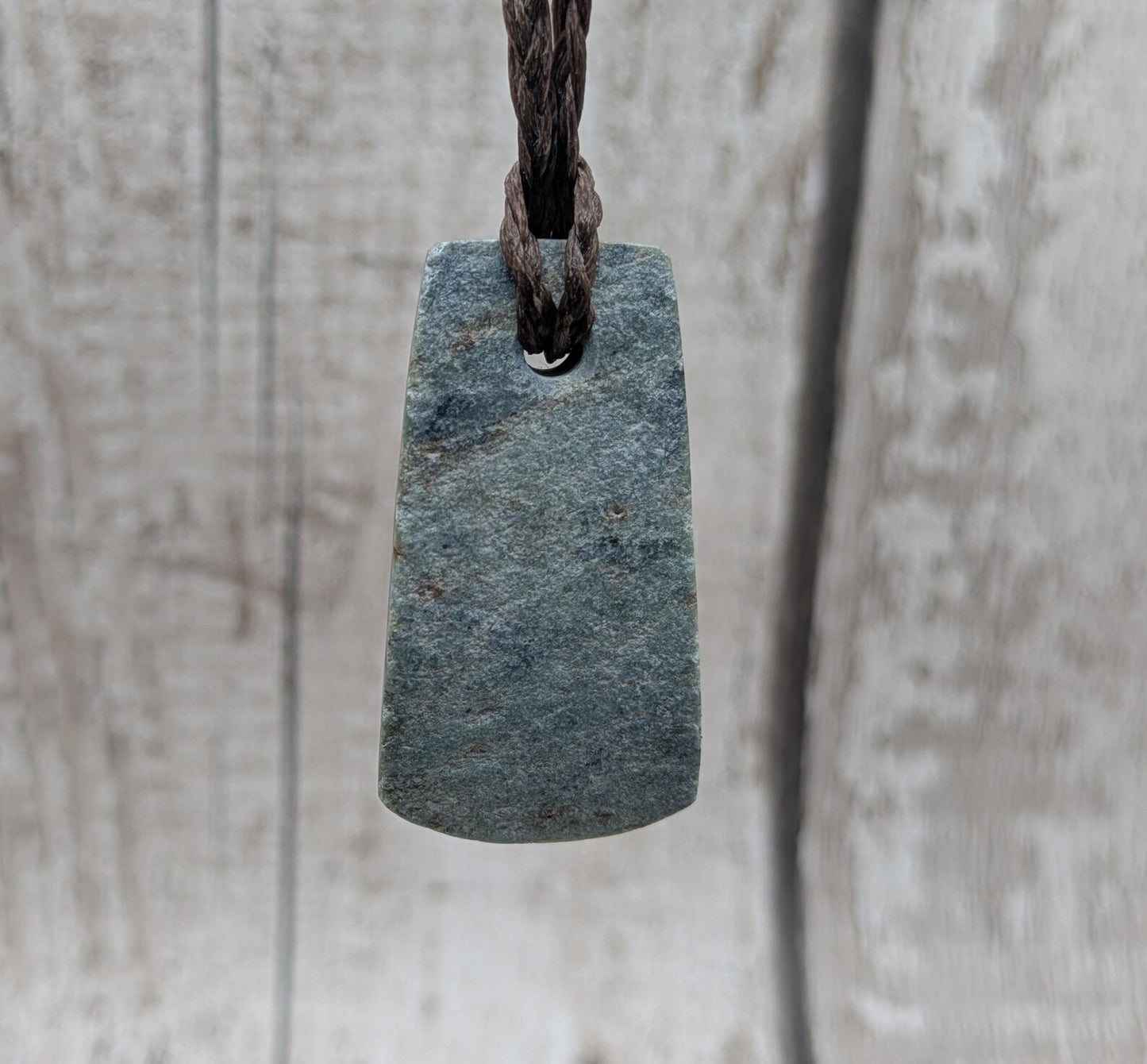 new Zealand pounamu greenstone jade pendant Off cut slice, raw weathered back, cultural and spiritual amulet.