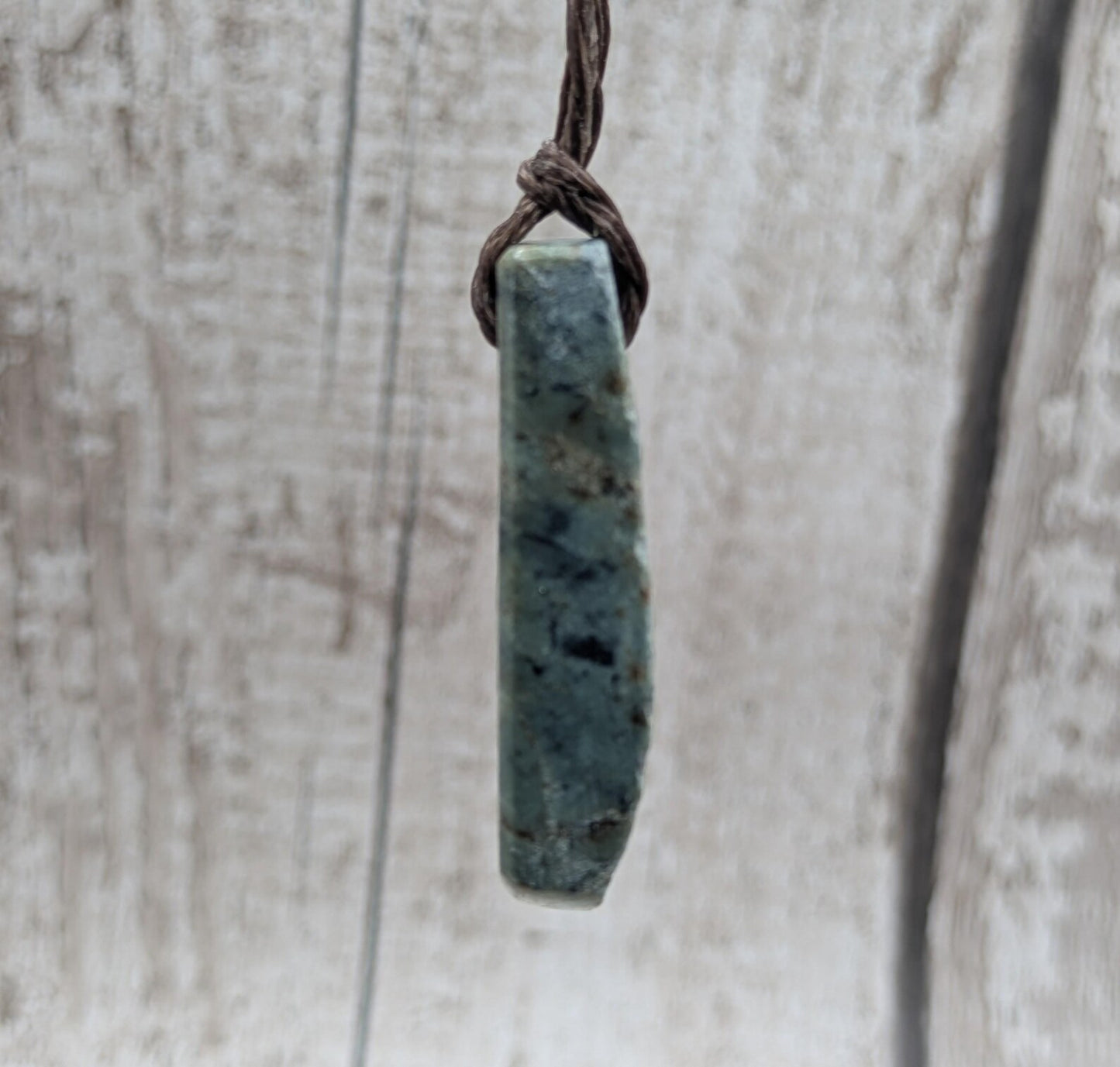 new Zealand pounamu greenstone jade pendant Off cut slice, raw weathered back, cultural and spiritual amulet.