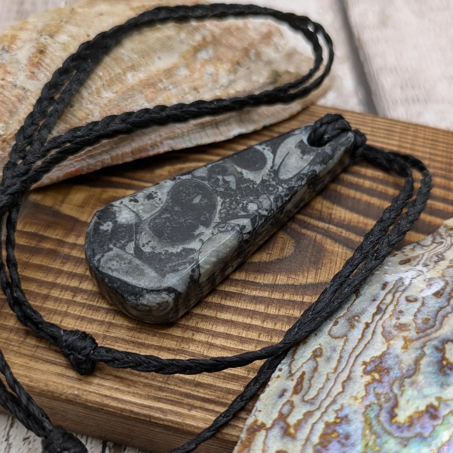 Fossil marble bedrock roimata pendant.