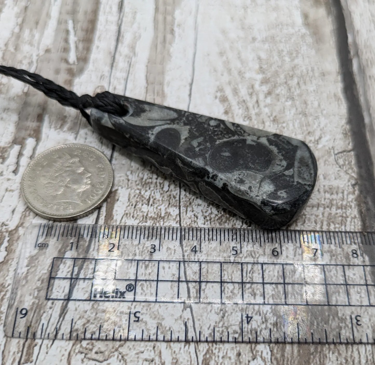 Fossil marble bedrock roimata pendant.