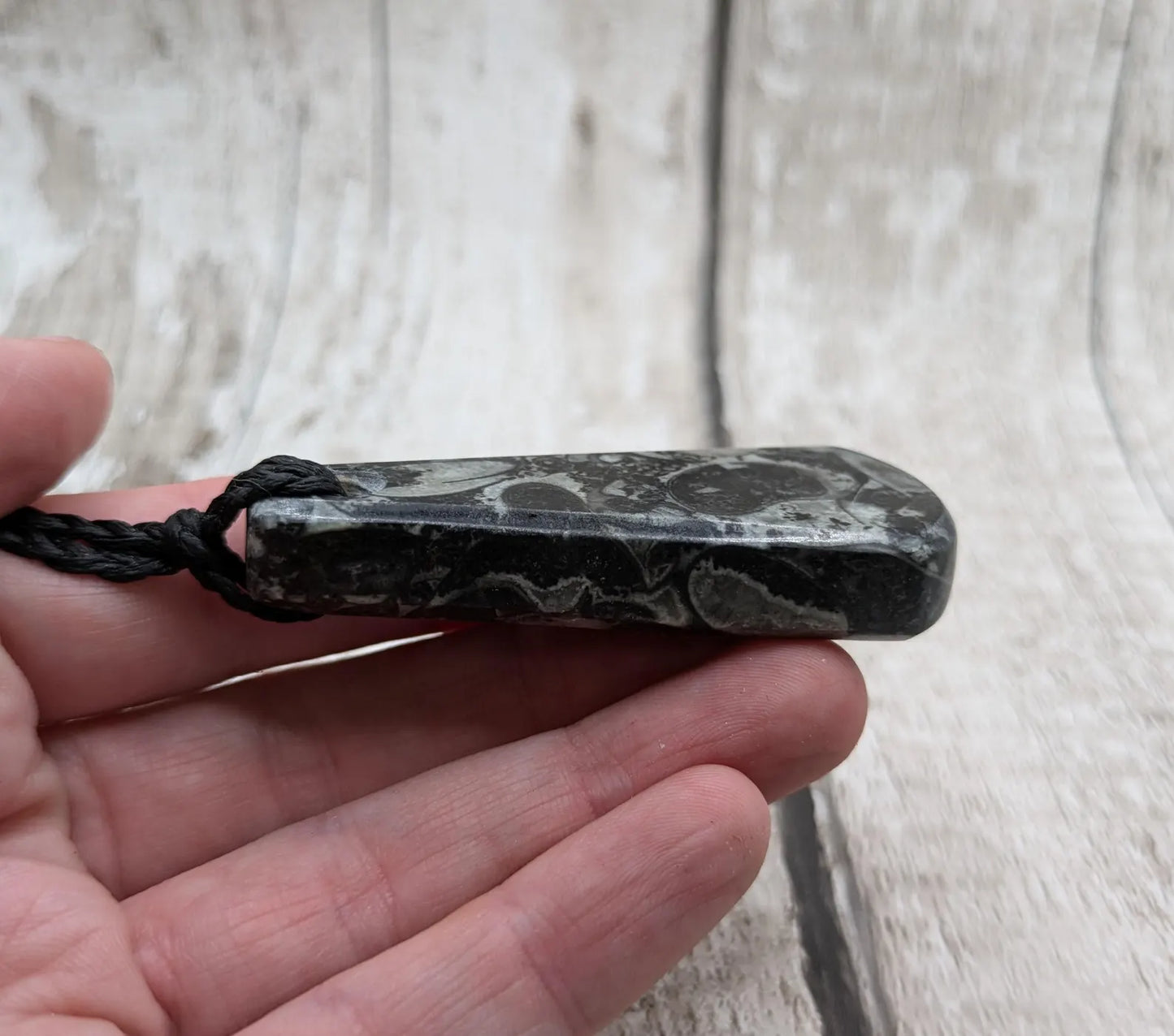 Fossil marble bedrock roimata pendant.