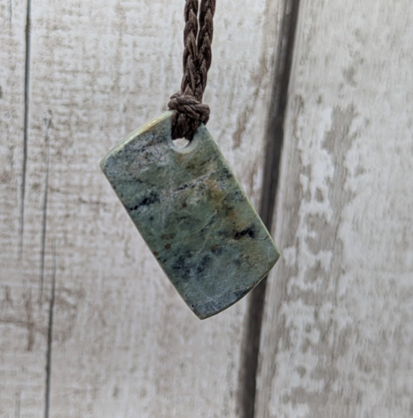 Raw back Pounamu Jade Pendant – Natural New Zealand Greenstone Offcut, Polished Sides, Affordable Spiritual and cultural Jewellery.